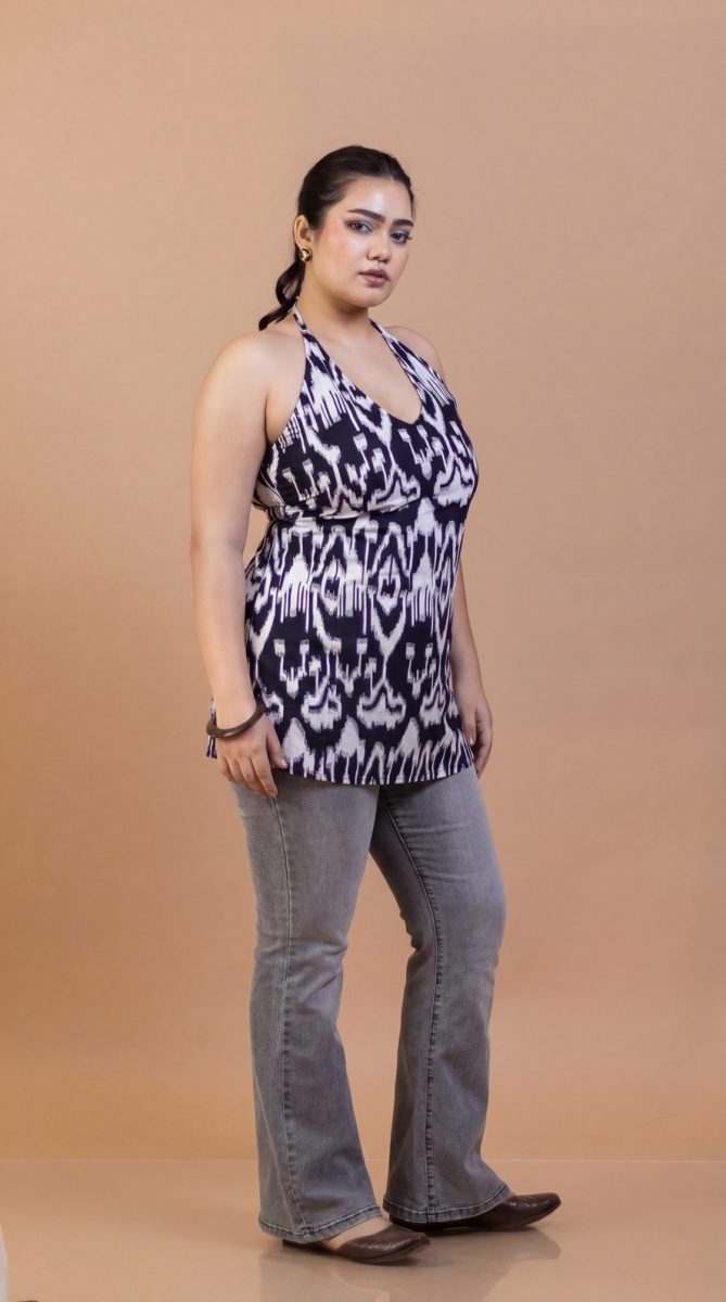 Black halter neck kurti paired with distressed bottom